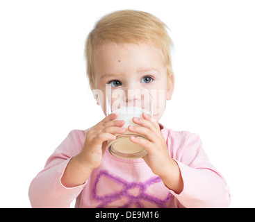 kid girl drinking yoghurt from glass isolated Stock Photo