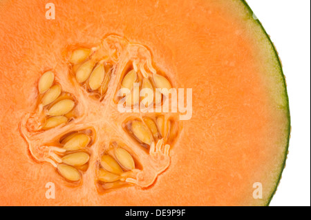 One side of an orange honeydew melon in closeup Stock Photo