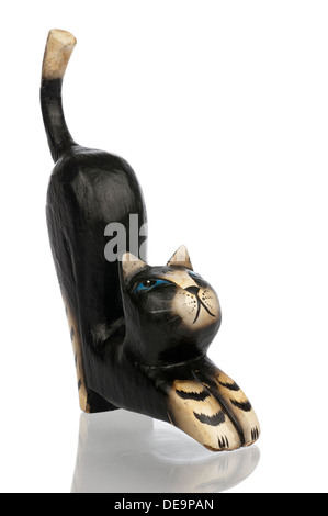 Wood carved statuette of a black kat isolated in white Stock Photo