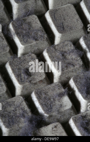 unused computer keyboard covered in dust and cobwebs Stock Photo