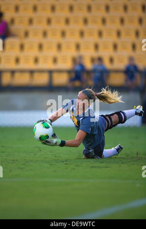 Kennesaw, Georgia.  USA.   September 13, 2013.   KSU goalie Olivia Sturdivant makes a diving stop during Ole Miss' 2-1 win over Kennesaw State at Fifth Third Bank Stadium.  Women's NCAA Division I Soccer. Stock Photo