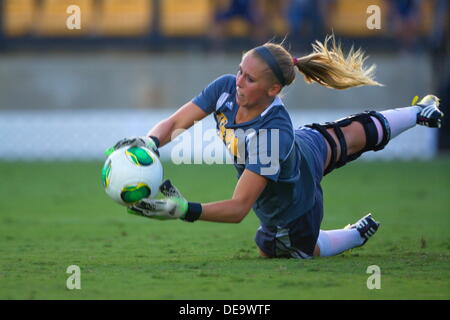 Kennesaw, Georgia.  USA.   September 13, 2013.   KSU goalie Olivia Sturdivant makes a diving stop during Ole Miss' 2-1 win over Kennesaw State at Fifth Third Bank Stadium.  Women's NCAA Division I Soccer. Stock Photo