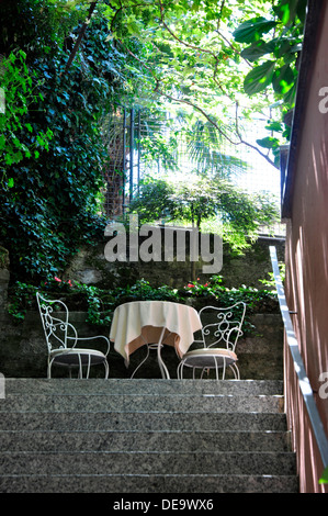 Italy - Lake Como - Bellagio - Salita Serbelloni narrow stepped street up from the lake - entrance to a romantic restaurant Stock Photo