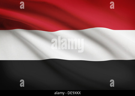 Yemeni flag blowing in the wind. Part of a series. Stock Photo