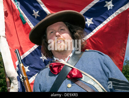 Sergeant on the Confederate camp wearing Grey-blue military jacket, and a large brown hat, a Soldier at Ingleton's Wild West Weekend featuring the American Civil War Society 12 Apr 1861 – 9 May 1865, with living history displays and re-enactments.  Confederate Soldiers wearing the uniforms and carrying the weapons of the 19c period. Stock Photo