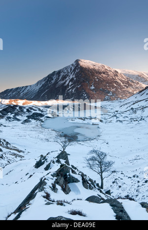 Llyn Idwal in Winter backed by Pen yr Ole Wen, Cwm Idwal, Snowdonia National Park, North Wales, UK Stock Photo