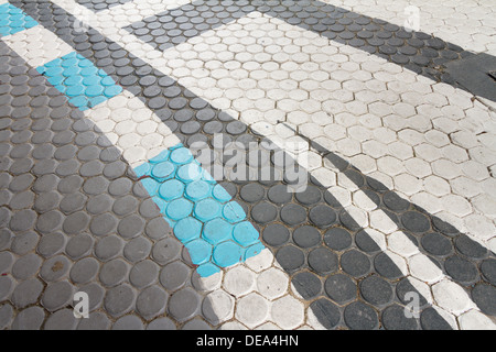 White and blue Traffic Line On Concrete paving block Stock Photo