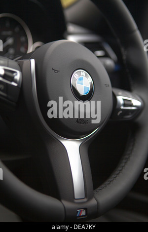Close up interior detail steering wheel of a F30 BMW 3 Series sedan saloon Stock Photo