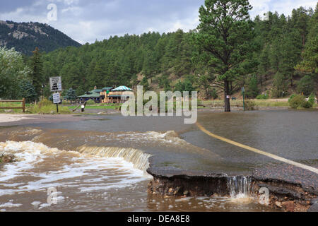 Evergreen, CO USA.  14 Sept, 2013. Upper Bear Creek floods over a road into Evergreen Lake as rainfall persists. Evergreen is expected to receive more rain through Sunday. © Ed Endicott  Alamy Live News Stock Photo