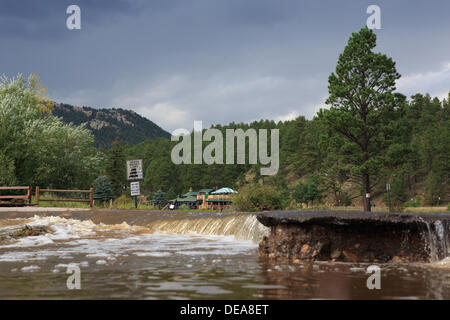 Evergreen, CO USA.  14 Sept, 2013. Upper Bear Creek floods over a road into Evergreen Lake as rainfall persists. Evergreen is expected to receive more rain through Sunday. © Ed Endicott  Alamy Live News Stock Photo