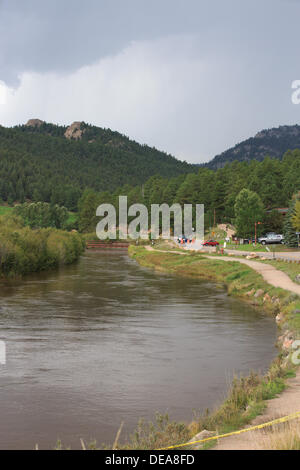 Evergreen, CO USA.  14 Sept, 2013. A police officer maintains a barricade along Upper Bear Creek Road as rainfall persists in the area.  Evergreen is expected to receive more rain through Sunday. © Ed Endicott  Alamy Live News Stock Photo