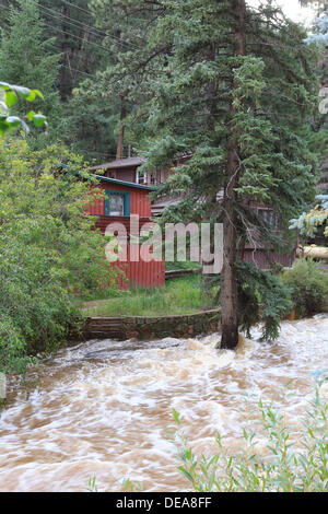 Evergreen, CO USA.  14 Sept, 2013. Houses along Highway 74 are in Danger as Bear Creek along Hwy 74 rises.  Evergreen is expected to receive more rain through Sunday. © Ed Endicott  Alamy Live News Stock Photo