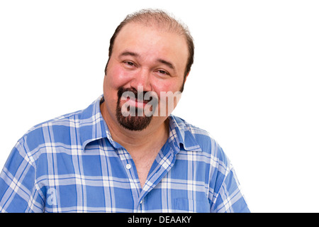 Overweight man with a goatee beard looking at the camera with an amused kindly expression isolated on white Stock Photo