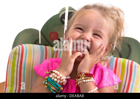 child sitting and laughing isolated on white Stock Photo