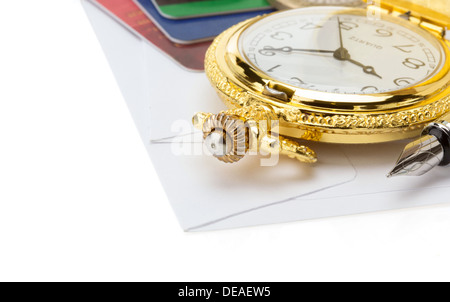 watch and pen at envelope isolated on white background Stock Photo