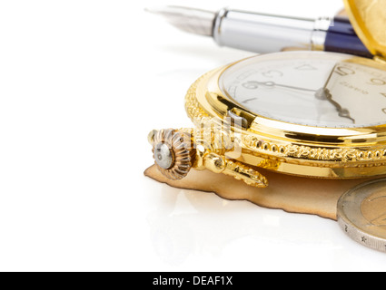 watch and ink pen at vintage parchment isolated on white background Stock Photo