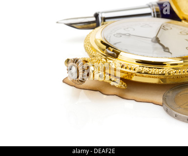 watch and ink pen at vintage parchment isolated on white background Stock Photo