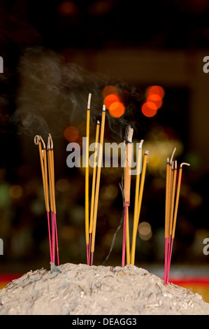 Lit incense sticks, Wat Phnom Temple, Phnom Penh, Cambodia, Southeast Asia Stock Photo