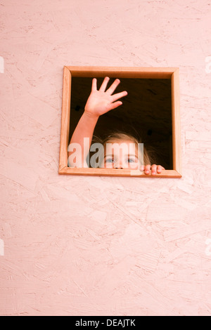 Girl, 3 years, in window Stock Photo