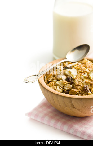 crunchy muesli in wooden bowl on white background Stock Photo