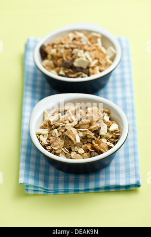 muesli in ceramic bowls on colorful background Stock Photo