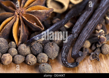 Assortment of Christmas spices on wooden Board as Close Up View Stock Photo
