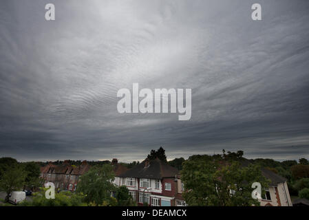 South West London, UK. 15 September 2013. After a sunny start, grey clouds gradually rolled in today from the north with some unusual formations seen in darkening skies heralding the first storm of Autumn. Credit:  Malcolm Park editorial/Alamy Live News Stock Photo