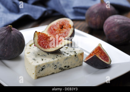 blue cheese and sweet fruit figs on a white plate Stock Photo