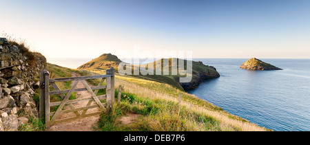Wooden gate on the south west coast path leading to The Rumps in Cornwall Stock Photo