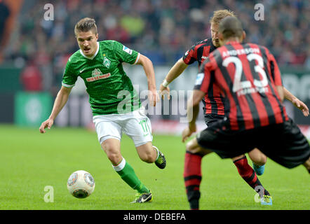 Bremen, Germany. 14th Sep, 2013. Bremen's Aleksandar Ignjovski (L) vies for the ball with Frankfurt's Stefan Aigner and Anderson (R) during the Bundesliga soccer match Werder Bremen vs Eintracht Frankfurt at the Weser Stadion in Bremen, Germany, 14 September 2013. Frankfurt wins 0-3. Photo: CARMEN JASPERSEN/dpa/Alamy Live News Stock Photo