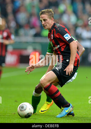 Bremen, Germany. 14th Sep, 2013. Frankfurt's Bastian Oczipka plays the ball during the Bundesliga soccer match Werder Bremen vs Eintracht Frankfurt at the Weser Stadion in Bremen, Germany, 14 September 2013. Photo: CARMEN JASPERSEN/dpa/Alamy Live News Stock Photo