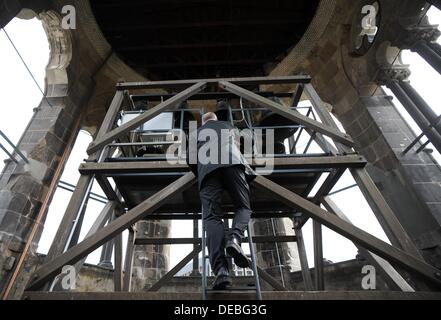 Berlin, Germany. 15th Sep, 2013. Porject manager Raphael Abrell climbs up to the bells of the Kaiser Wilhelm Memorial Church in Berlin, Germany, 15 September 2013. The church tower has been refurbished and the restored chime rang again at twelve noon. Photo: BRITTA PEDERSEN/dpa/Alamy Live News Stock Photo