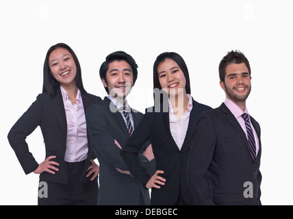 Portrait of four young business people looking at the camera, three quarter length, studio shot Stock Photo