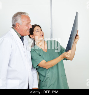 Nurse showing a x-ray image to doctor in a hospital Stock Photo