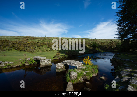 The remains of a clapper bridge crossing the East Dart River at Bellever Forest, Dartmoor National Park Devon Uk Stock Photo