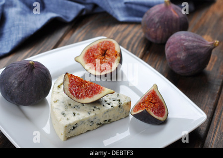 blue cheese and sweet fruit figs on a white plate Stock Photo