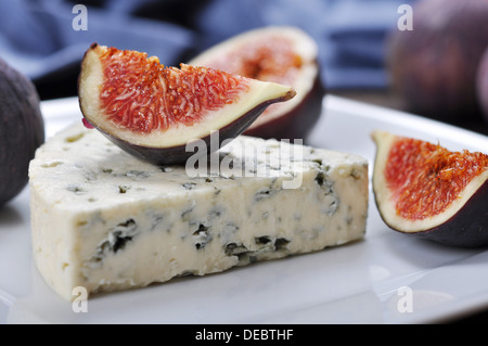 blue cheese and sweet fruit figs on a white plate Stock Photo