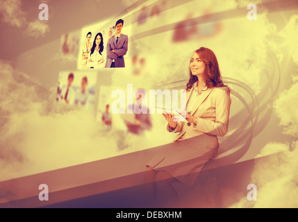 Pretty businesswoman using digital interface Stock Photo