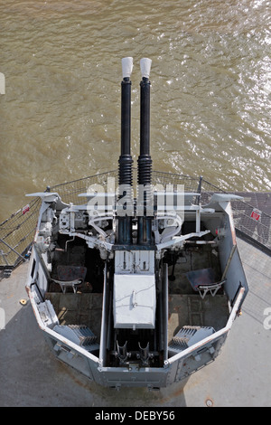 40mm Bofors anti-aircraft guns on HMS Belfast, a Royal Navy light cruiser, moored on the River Thames, London, UK. Stock Photo