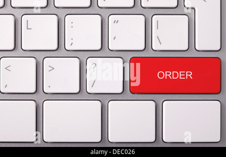 Laptop keyboard and red key 'ORDER' on it Stock Photo