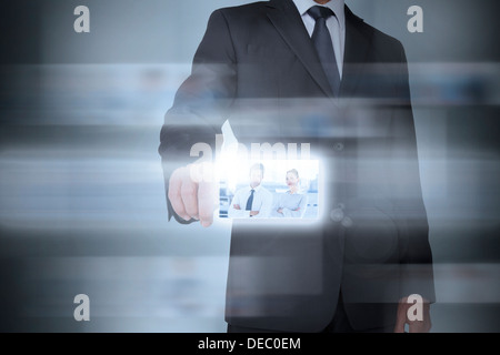 Stylish businessman using futuristic interface Stock Photo