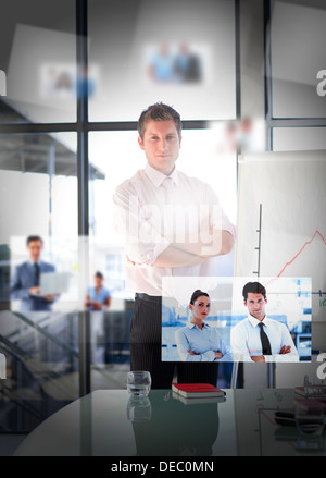 Businessman posing in bright office Stock Photo