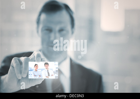 Businessman presenting digital interface Stock Photo