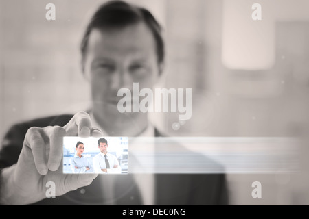 Classy businessman presenting digital interface Stock Photo