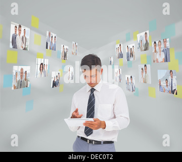 Businessman working on his tablet pc Stock Photo