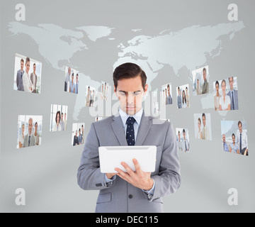 Businessman using his tablet pc Stock Photo