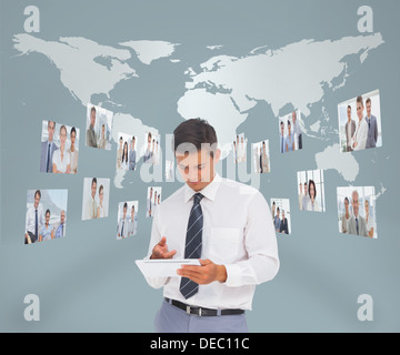 Businessman working on his tablet computer Stock Photo
