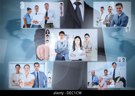 Businessman presenting pictures of coworkers Stock Photo
