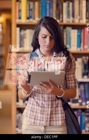 Cute student working on her digital tablet Stock Photo