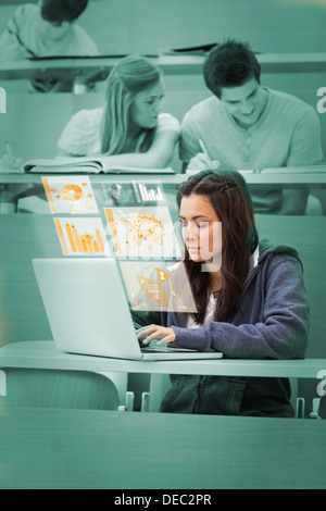 Pretty brunette studying on her digital computer Stock Photo